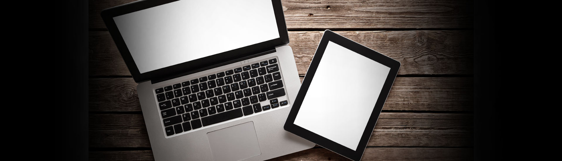 Open Laptop With Digital Tablet on Wooden Desk